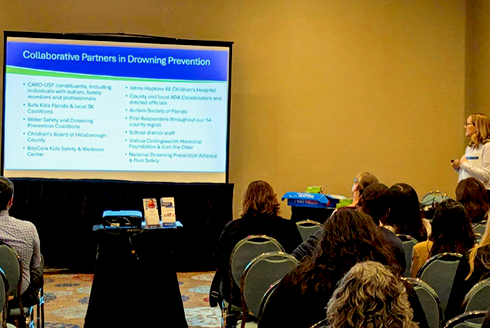 christine hugh at podium